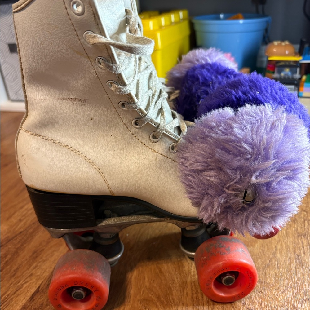 Vintage roller derby skates with Purple Pom Poms